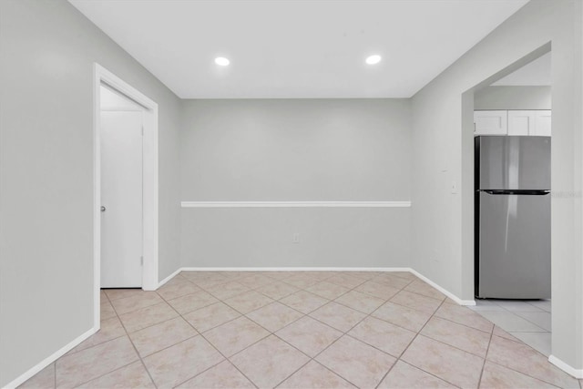 4444 Swift Rd Unit 20, Sarasota, FL 34231 - empty room with light tile patterned floors, baseboards, and recessed lighting