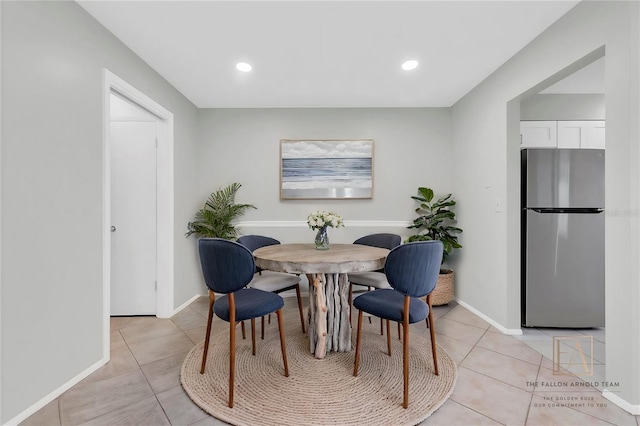 4444 Swift Rd Unit 20, Sarasota, FL 34231 - dining room featuring light tile patterned floors, baseboards, and recessed lighting