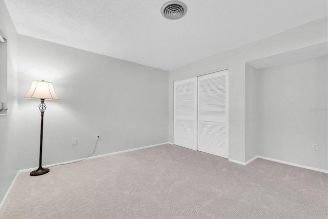 4444 Swift Rd Unit 20, Sarasota, FL 34231 - unfurnished bedroom with carpet, baseboards, and a closet