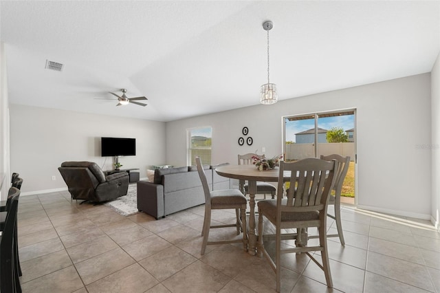 dining room with ceiling fan and light tile patterned floors