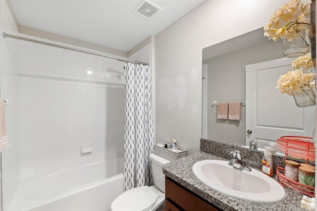 full bathroom featuring shower / bath combination with curtain, vanity, and toilet