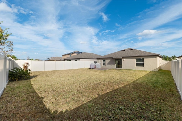 rear view of house with a yard