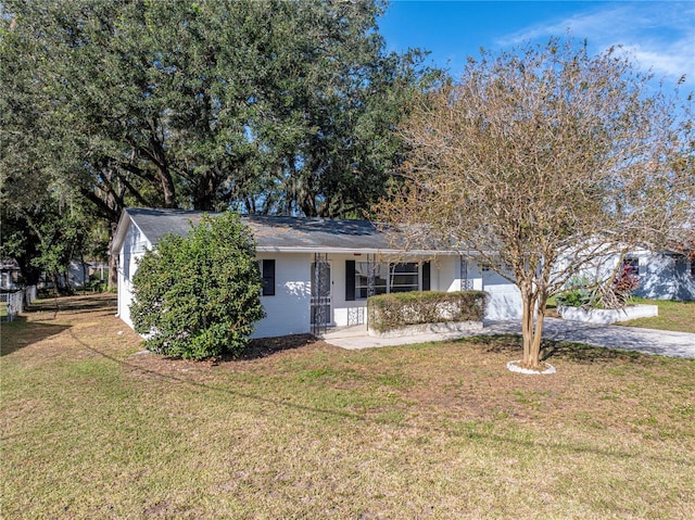 view of front of house featuring a front yard and covered porch