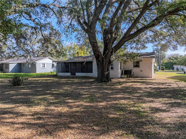 rear view of house with a sunroom