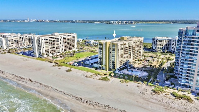 birds eye view of property featuring a water view and a view of the beach