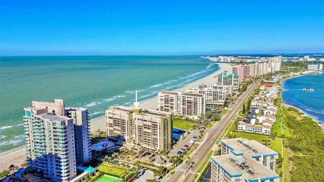 birds eye view of property featuring a beach view and a water view