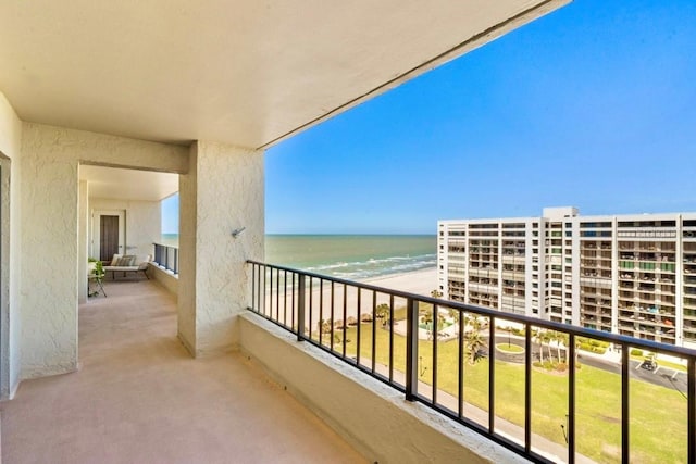 balcony with a view of the beach and a water view