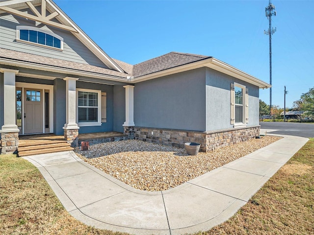 property entrance with covered porch