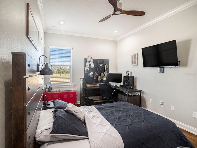 bedroom with hardwood / wood-style floors, ceiling fan, and ornamental molding