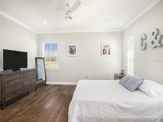 bedroom with dark hardwood / wood-style flooring, ceiling fan, and crown molding