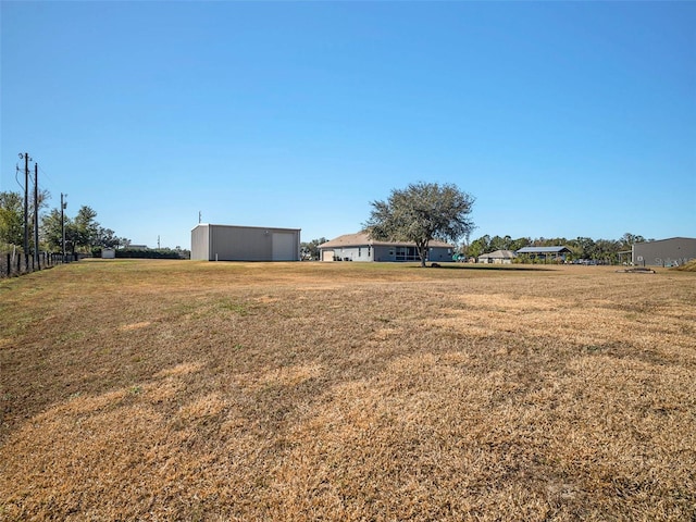 view of yard with an outdoor structure