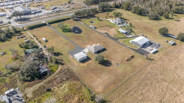 birds eye view of property with a rural view