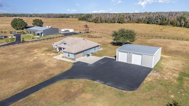 birds eye view of property with a rural view