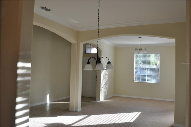 unfurnished dining area featuring a notable chandelier, carpet floors, and ornamental molding