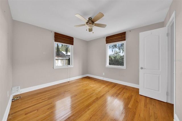 unfurnished room featuring ceiling fan and hardwood / wood-style flooring