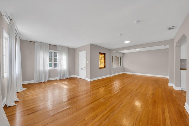 unfurnished living room featuring light wood-type flooring