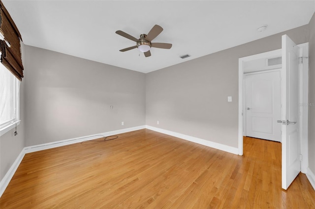 unfurnished room with ceiling fan and light hardwood / wood-style flooring