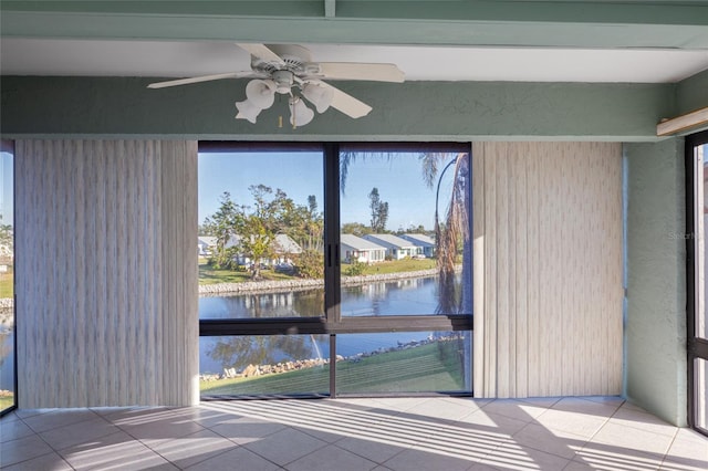 4859 Independence Dr, Bradenton, FL 34210 - interior space with a water view, tile patterned flooring, a ceiling fan, and a residential view