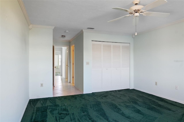 4859 Independence Dr, Bradenton, FL 34210 - unfurnished bedroom with carpet floors, ornamental molding, a closet, ceiling fan, and baseboards