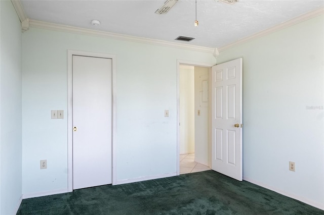 4859 Independence Dr, Bradenton, FL 34210 - unfurnished bedroom with ornamental molding, carpet floors, and baseboards