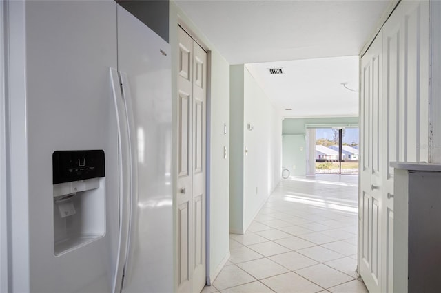 4859 Independence Dr, Bradenton, FL 34210 - hallway featuring light tile patterned floors and baseboards