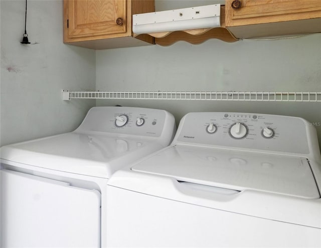4859 Independence Dr, Bradenton, FL 34210 - washroom with cabinet space and washing machine and dryer