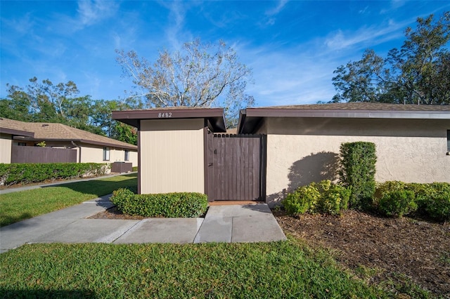 view of home's exterior with a yard