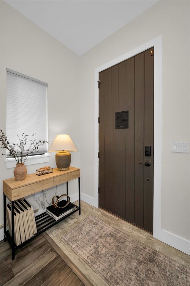 foyer entrance featuring hardwood / wood-style floors