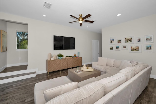 living room with ceiling fan and dark hardwood / wood-style floors