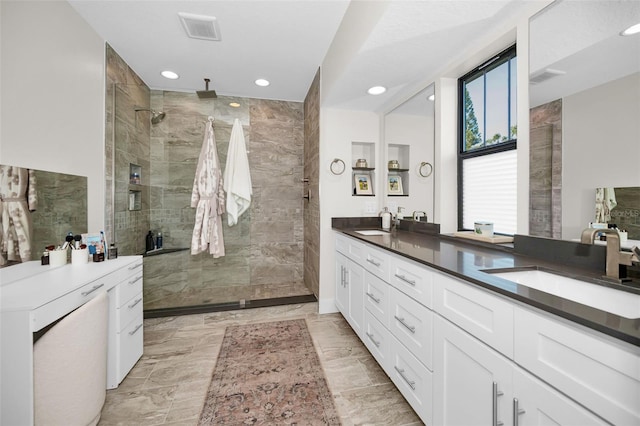 bathroom featuring vanity and walk in shower