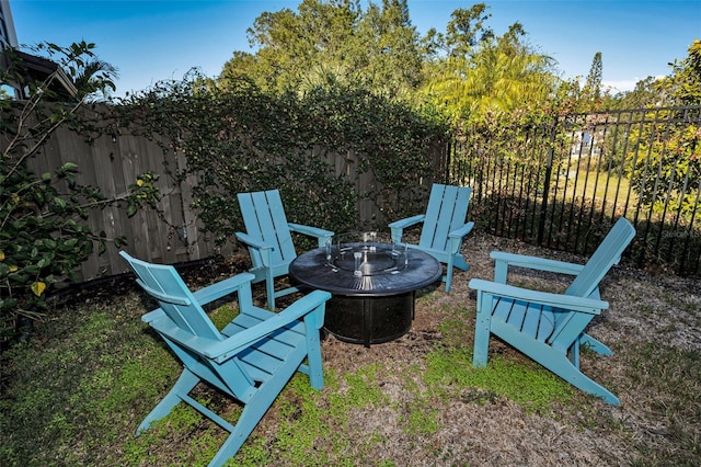 view of yard featuring an outdoor fire pit