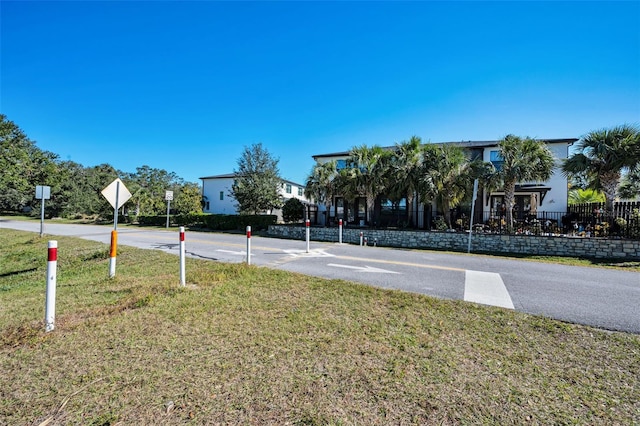 view of basketball court featuring a yard