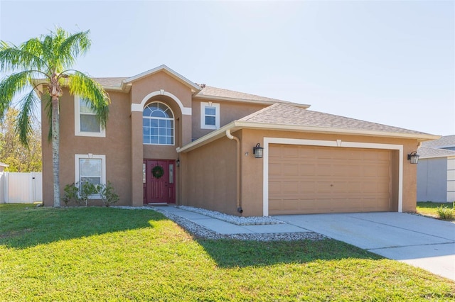 view of front of home featuring a garage and a front lawn