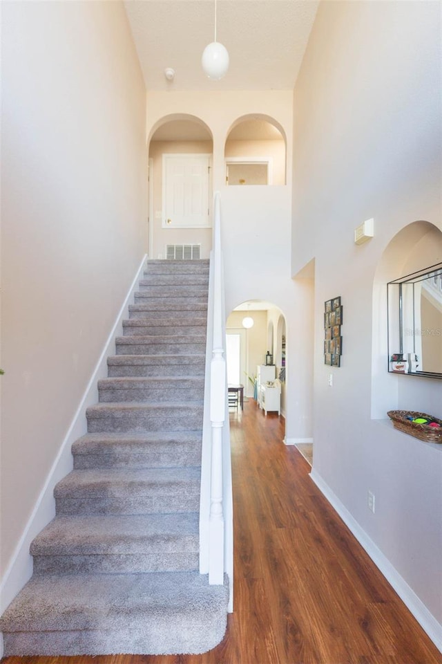 stairs with wood-type flooring