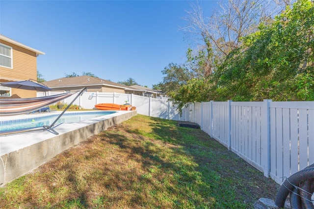 view of yard featuring a covered pool