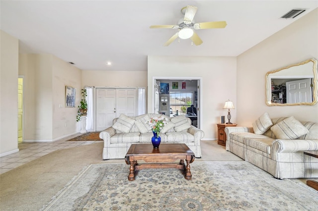 living room featuring ceiling fan and light tile patterned flooring