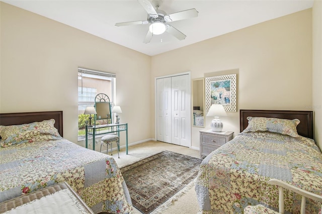 bedroom featuring carpet flooring, ceiling fan, and a closet