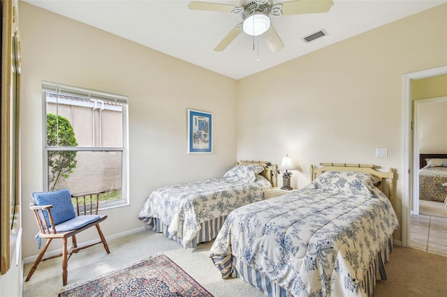 bedroom with carpet flooring, ceiling fan, and multiple windows