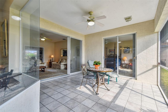 sunroom / solarium with ceiling fan