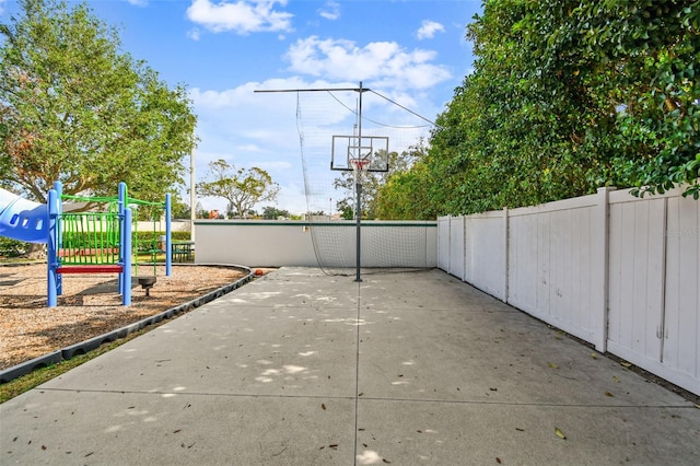 view of patio with basketball hoop