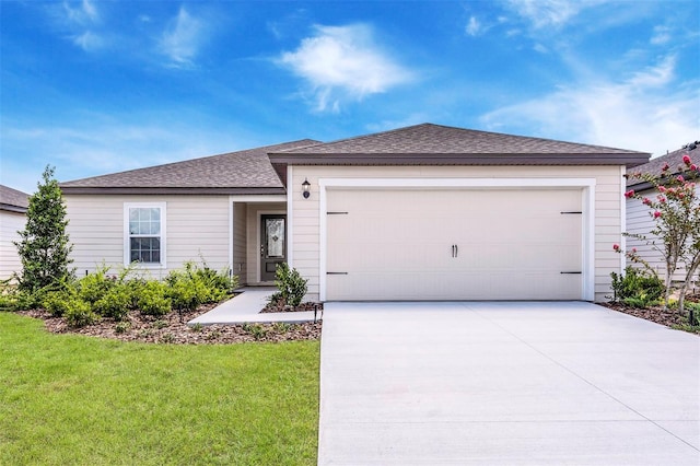 single story home with a front lawn and a garage