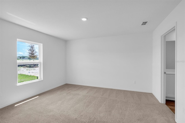 13 Prince Anthony Ln, Palm Coast, FL 32164 - spare room featuring carpet floors, baseboards, and recessed lighting