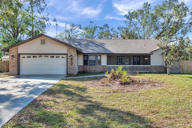 ranch-style house with a garage and a front lawn