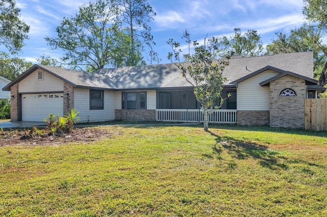 ranch-style home with a front yard and a garage