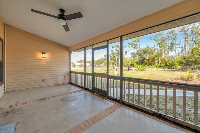 unfurnished sunroom with ceiling fan and lofted ceiling