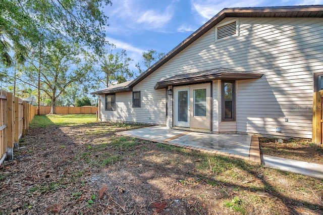 back of property with a patio area