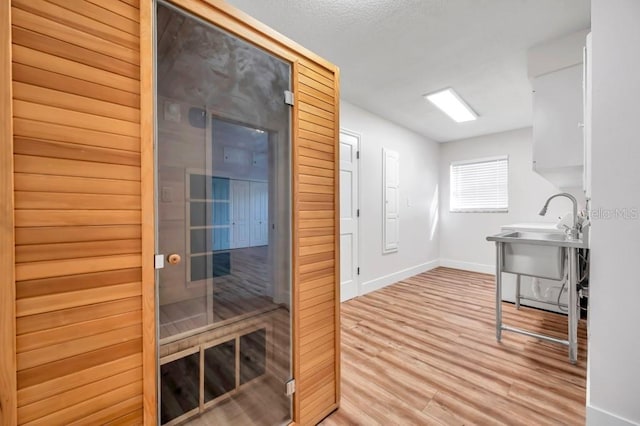 view of sauna with hardwood / wood-style flooring