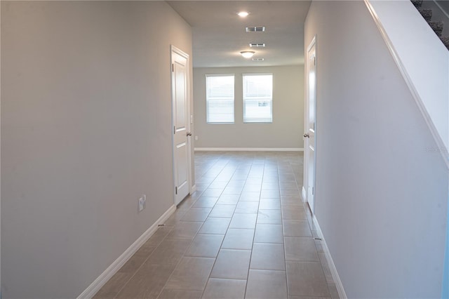 hallway with light tile patterned floors