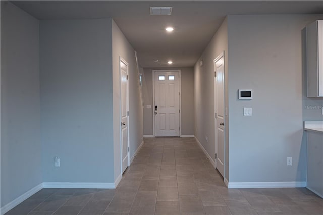 doorway featuring light tile patterned floors