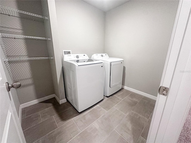 laundry room with independent washer and dryer